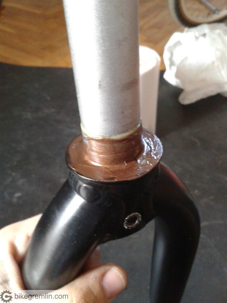 Copper grease smeared over the fork crown